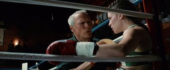 Movie still from “Million Dollar Baby” (2004), directed by Clint Eastwood – An older man and a young man in a boxing ring; Close Up shot, Low angle