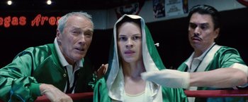Movie still from “Million Dollar Baby” (2004), directed by Clint Eastwood – An older man and a young woman in a boxing ring; Close Up shot, Low angle