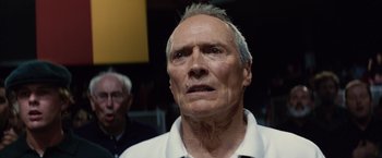 Movie still from “Million Dollar Baby” (2004), directed by Clint Eastwood – An older man with a white shirt looking at the camera; Close Up shot, Low angle