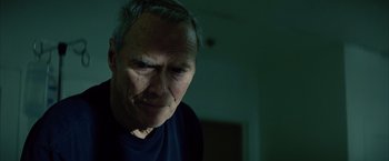 Movie still from “Million Dollar Baby” (2004), directed by Clint Eastwood – An older man is looking at the camera; Close Up shot, Low angle
