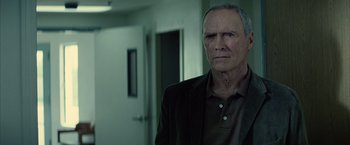Movie still from “Million Dollar Baby” (2004), directed by Clint Eastwood – An older man standing in front of a door; Close Up shot, Low angle