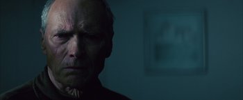 Movie still from “Million Dollar Baby” (2004), directed by Clint Eastwood – A person in a dark room; Close Up shot, Low angle