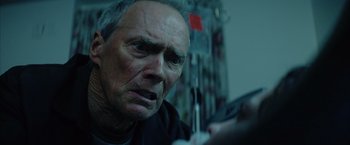 Movie still from “Million Dollar Baby” (2004), directed by Clint Eastwood – An older man is looking into the camera; Close Up shot, Low angle