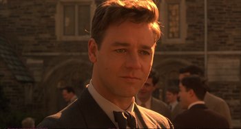 Movie still from “A Beautiful Mind” (2001), directed by Ron Howard – A person wearing a suit and tie; Close Up shot, Low angle