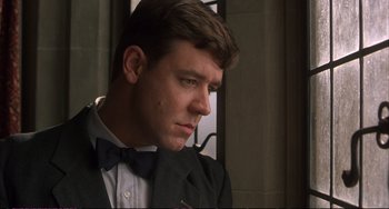 Movie still from “A Beautiful Mind” (2001), directed by Ron Howard – A person wearing a suit and bow tie; Close Up shot, Low angle