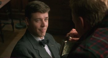 Movie still from “A Beautiful Mind” (2001), directed by Ron Howard – A man in a bow tie is talking to another man; Close Up shot, Over the shoulder angle