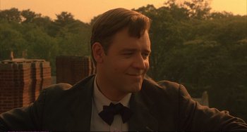 Movie still from “A Beautiful Mind” (2001), directed by Ron Howard – A person wearing a suit and bow tie; Close Up shot, Over the shoulder angle