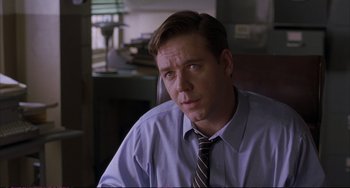 Movie still from “A Beautiful Mind” (2001), directed by Ron Howard – A person wearing a shirt and a tie; Close Up shot, Over the shoulder angle