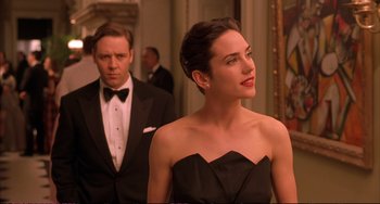 Movie still from “A Beautiful Mind” (2001), directed by Ron Howard – A man and a woman standing next to each other in a room; Medium shot, Over the shoulder angle