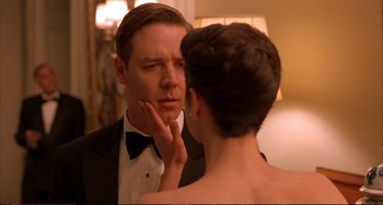 Movie still from “A Beautiful Mind” (2001), directed by Ron Howard – A man and a woman looking in the same direction in the same mirror; Close Up shot, Over the shoulder angle