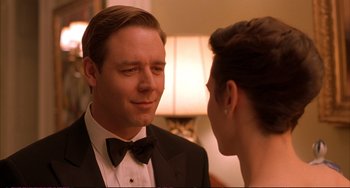 Movie still from “A Beautiful Mind” (2001), directed by Ron Howard – A man and a woman in formal wear looking at one another; Close Up shot, Over the shoulder angle