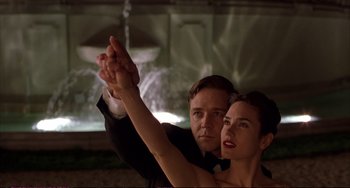 Movie still from “A Beautiful Mind” (2001), directed by Ron Howard – A man and a woman holding their hands in the air; Close Up shot, Low angle