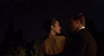Movie still from “A Beautiful Mind” (2001), directed by Ron Howard – A man and a woman standing next to each other in front of a night sky; Medium shot, Low angle