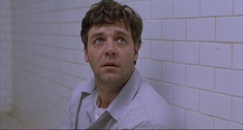 Movie still from “A Beautiful Mind” (2001), directed by Ron Howard – A person wearing a shirt and tie; Close Up shot, Low angle
