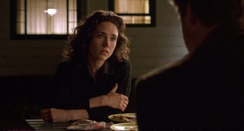 Movie still from “A Beautiful Mind” (2001), directed by Ron Howard – A woman sitting at a table with a plate in front of her; Close Up shot, Over the shoulder angle
