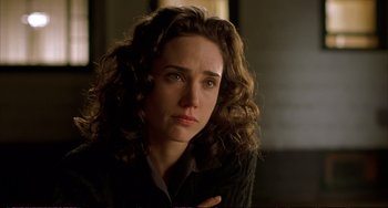Movie still from “A Beautiful Mind” (2001), directed by Ron Howard – A person with curly hair; Close Up shot, Over the shoulder angle