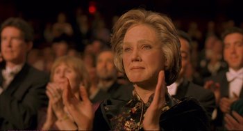 Movie still from “A Beautiful Mind” (2001), directed by Ron Howard – An older woman clapping in front of an audience; Close Up shot, Low angle