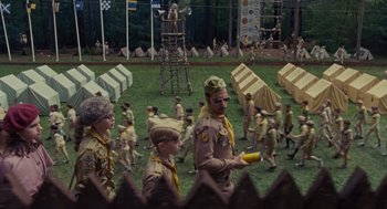 Movie still from “Moonrise Kingdom” (2012), directed by Wes Anderson – A group of young boys in scout uniforms; Wide shot, High angle