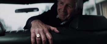 Movie still from “Mystic River” (2003), directed by Clint Eastwood – An older man sitting in the back seat of a car; Close Up shot, Over the shoulder angle