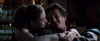 Movie still from “Mystic River” (2003), directed by Clint Eastwood – A man and a woman embracing each other; Close Up shot, Over the shoulder angle
