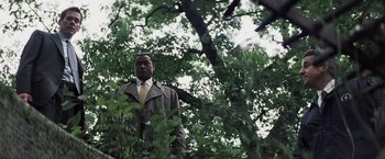 Movie still from “Mystic River” (2003), directed by Clint Eastwood – A man standing in the middle of a forest; Medium shot, Low angle