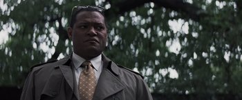 Movie still from “Mystic River” (2003), directed by Clint Eastwood – A man in a brown jacket and a tie; Close Up shot, Low angle