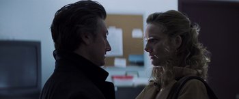 Movie still from “Mystic River” (2003), directed by Clint Eastwood – A man and a woman face to face in a dark room; Close Up shot, Low angle