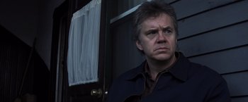 Movie still from “Mystic River” (2003), directed by Clint Eastwood – A person wearing a jacket; Close Up shot, Low angle