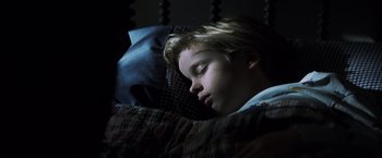 Movie still from “Mystic River” (2003), directed by Clint Eastwood – A young boy is sleeping in a bed; Close Up shot, Overhead angle