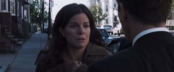 Movie still from “Mystic River” (2003), directed by Clint Eastwood – A person with her hand on her chin; Close Up shot, Over the shoulder angle