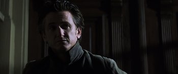 Movie still from “Mystic River” (2003), directed by Clint Eastwood – A person wearing a jacket; Close Up shot, Low angle