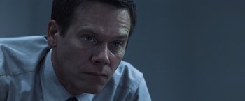 Movie still from “Mystic River” (2003), directed by Clint Eastwood – A person wearing a dress shirt and tie; Close Up shot, Low angle
