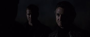 Movie still from “Mystic River” (2003), directed by Clint Eastwood – Two men in the dark looking at the camera; Close Up shot, Low angle