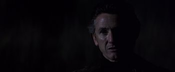 Movie still from “Mystic River” (2003), directed by Clint Eastwood – A person's face in the dark; Close Up shot, Low angle