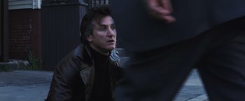 Movie still from “Mystic River” (2003), directed by Clint Eastwood – A person wearing a leather jacket; Close Up shot, Low angle