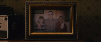 Movie still from “Nobody” (2021), directed by Ilya Naishuller – A picture of a man and two young boys in a frame; Close Up shot, High angle
