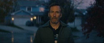 Movie still from “Nobody” (2021), directed by Ilya Naishuller – A person wearing a jacket; Close Up shot, Low angle