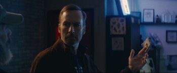 Movie still from “Nobody” (2021), directed by Ilya Naishuller – A person wearing a jacket; Close Up shot, Low angle