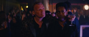 Movie still from “Nobody” (2021), directed by Ilya Naishuller – A man in a black jacket and a man in a black jacket; Close Up shot, Over the shoulder angle