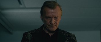 Movie still from “Nobody” (2021), directed by Ilya Naishuller – A person wearing a black shirt; Close Up shot, Low angle