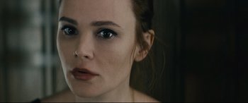 Movie still from “Nobody” (2021), directed by Ilya Naishuller – A woman's face with blue eyes; Close Up shot, High angle