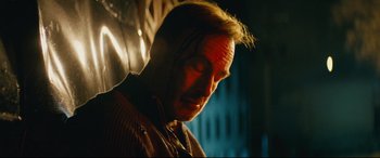 Movie still from “Nobody” (2021), directed by Ilya Naishuller – A person wearing a sweater; Close Up shot, Low angle