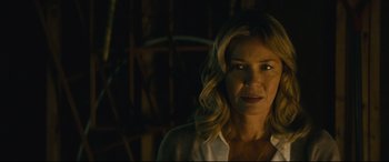 Movie still from “Nobody” (2021), directed by Ilya Naishuller – A person wearing a white shirt; Close Up shot, Over the shoulder angle