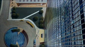 An aerial view of a building and a parking lot