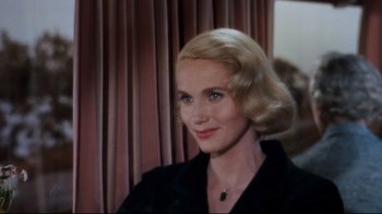 Movie still from “North by Northwest” (1959), directed by Alfred Hitchcock – A person wearing a black shirt; Close Up shot, Over the shoulder angle