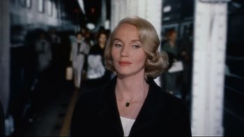 Movie still from “North by Northwest” (1959), directed by Alfred Hitchcock – A woman with blonde hair wearing a black jacket; Close Up shot, Over the shoulder angle