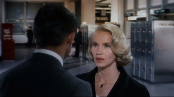 Movie still from “North by Northwest” (1959), directed by Alfred Hitchcock – A man and a woman are standing in front of each other; Close Up shot, Over the shoulder angle