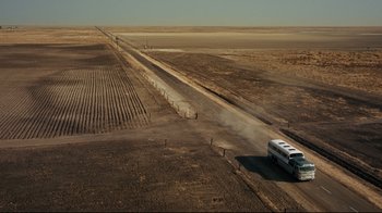 Movie still from “North by Northwest” (1959), directed by Alfred Hitchcock – An aerial view of a bus driving down a dirt road; Extreme Wide shot, High angle