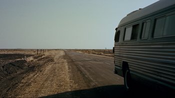 Movie still from “North by Northwest” (1959), directed by Alfred Hitchcock – An rv is driving down a road in the desert; Extreme Wide shot, High angle