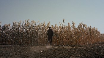 Movie still from “North by Northwest” (1959), directed by Alfred Hitchcock – A man standing in front of a field of corn; Extreme Wide shot, Low angle